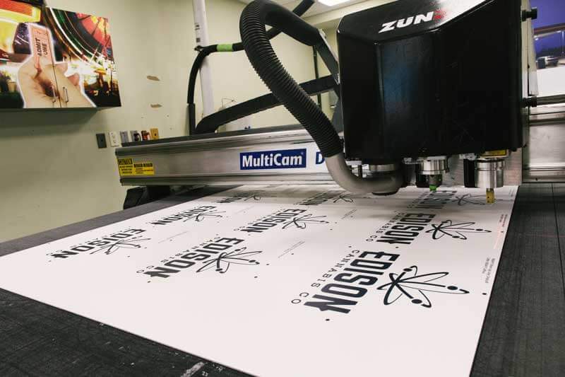 View of a finishing process running on printed Edison logos